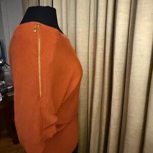 Tangerine light knit sweater, with gold zippers, Sienna Sage. Size medium.